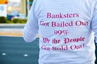 Occupy Las Vegas demonstrates in front of NV Energy, speaking out against rate increases, Wednesday Nov. 9, 2011